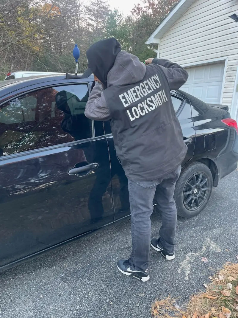 Locksmith opening a car door on a lockout call in Bethlehem